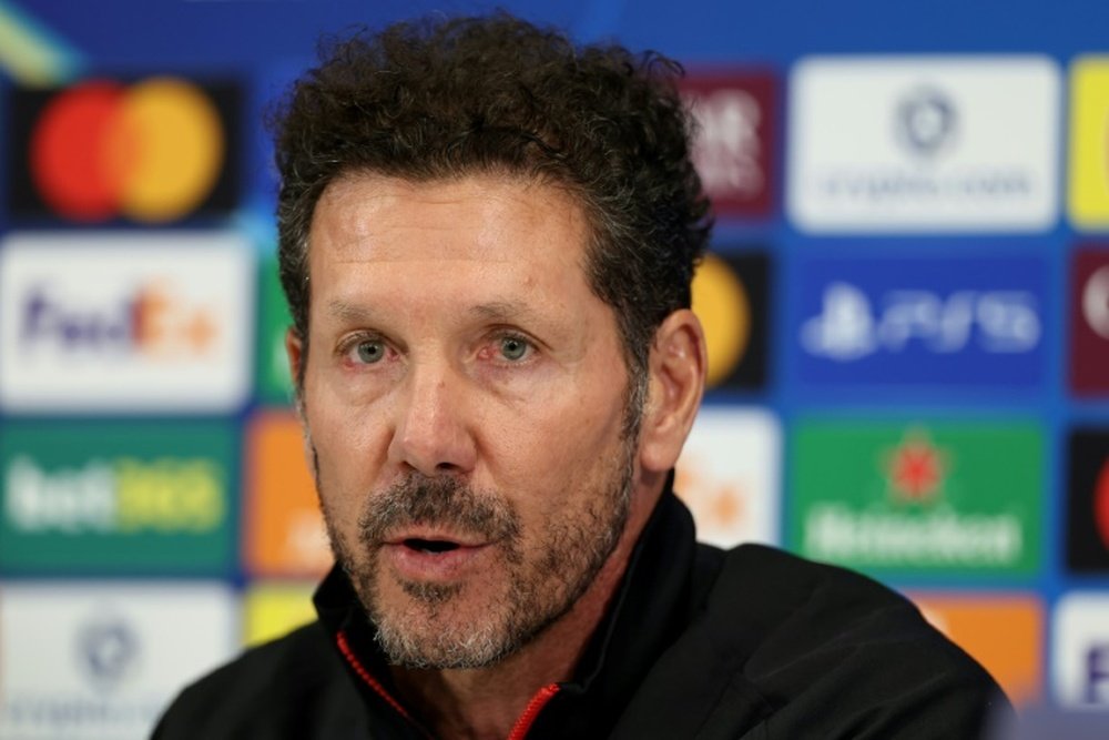 Simeone is without five key players for the trip to Anfield. AFP