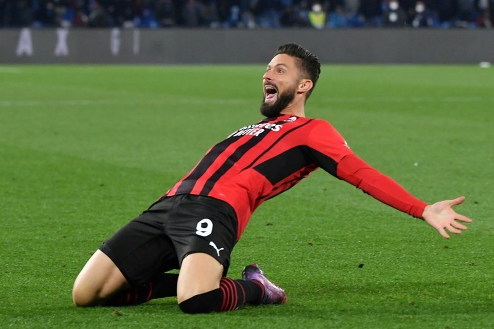 Giroud sinks Napoli to fire Milan top. AFP