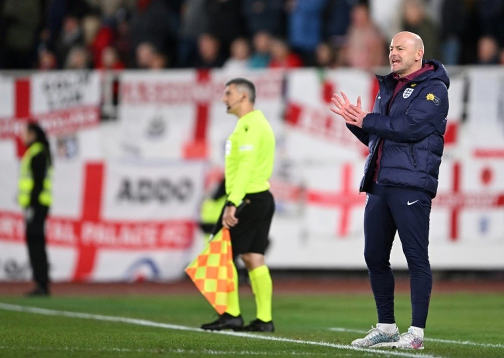 Rice says England's players love playing under caretaker boss Carsley. AFP