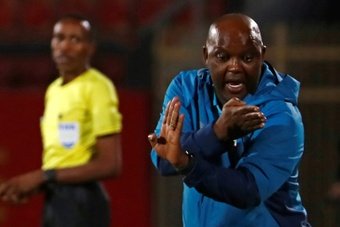 Pitso Mosimane gestures during the first leg of a CAF Champions League semi-final. AFP