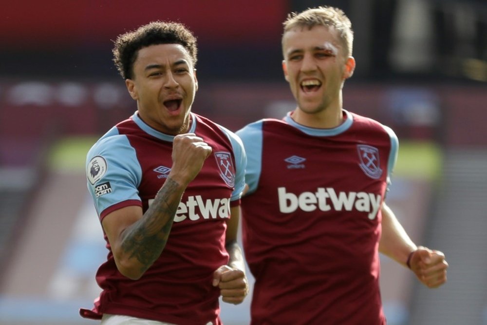 Lingard (L) scored to send West Ham into the Champions League spots. AFP