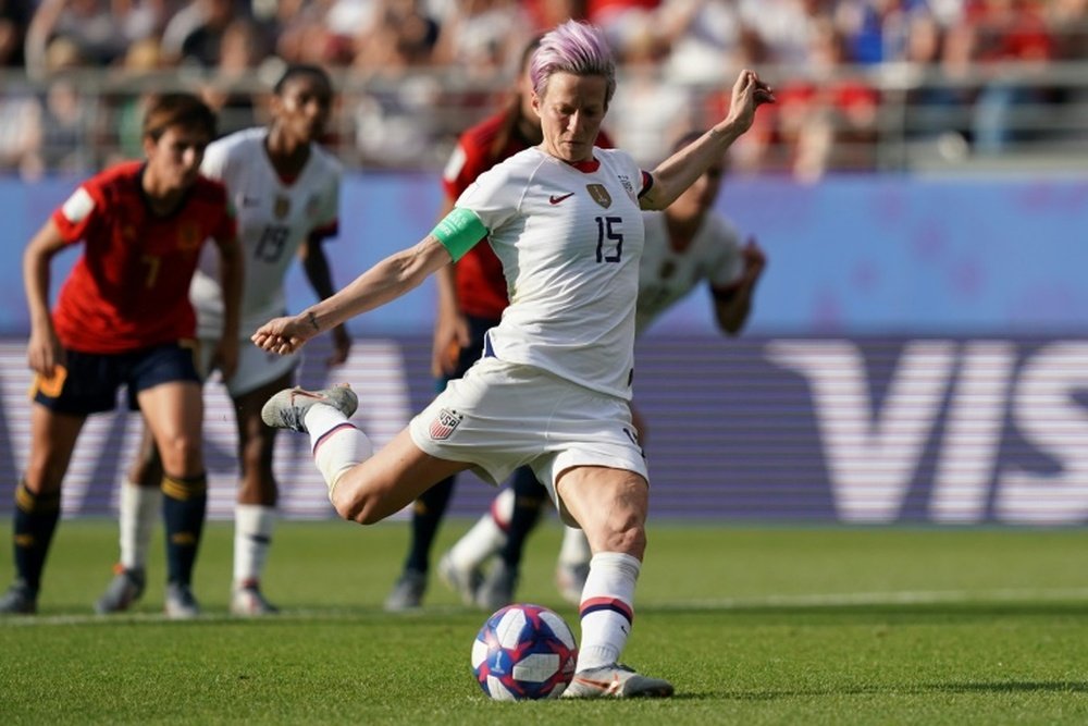 Rapinoe scored 2 penalties to see the USA through to the last 8. AFP