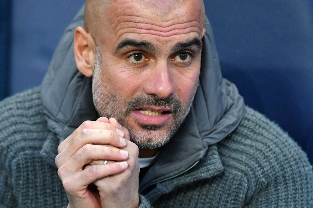 Pep Guardiola's Manchester City are chasing an unprecedented English domestic treble. AFP