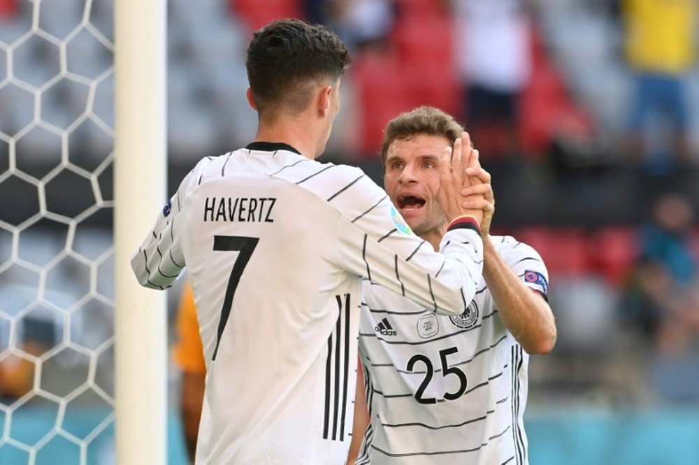 Thomas Muller (R) was happy after Germany beat Portugal. AFP