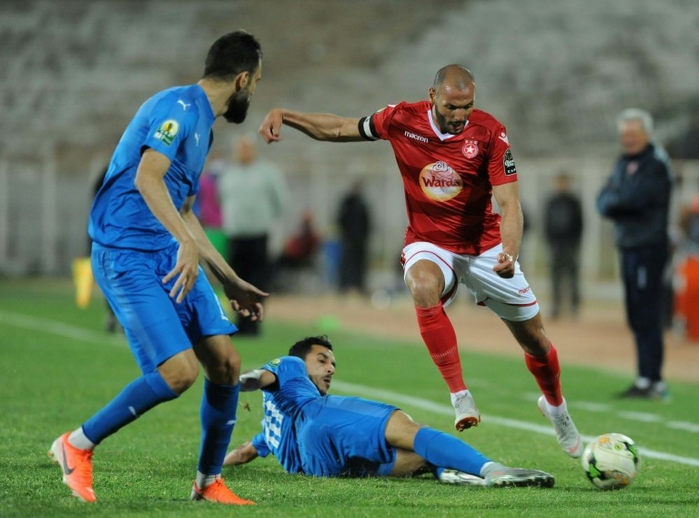 A file photo of Etoile Sahel midfielder Yassine Chikhaoui (R). AFP