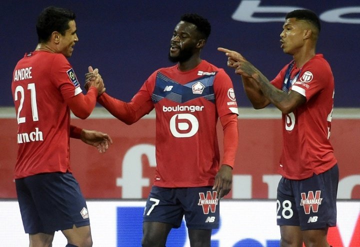 Unbeaten Lille held by stubborn 10-man Lyon