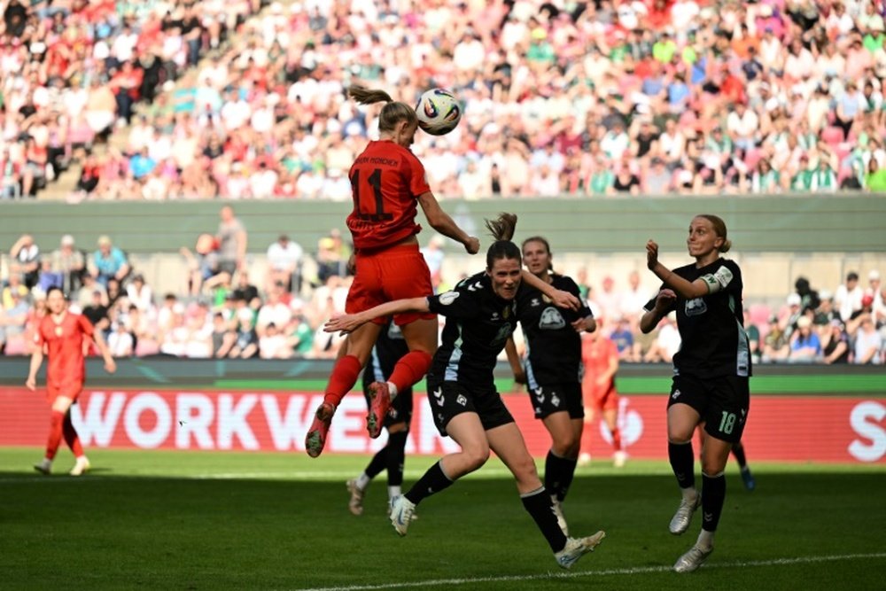 Schueller heads home Bayern Munichs third goal in their 4-2 German Cup final. AFP