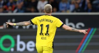 Borussia Dortmund spent the night atop the Bundesliga table for the first time since the penultimate round of last season, winning 3-1 at Hoffenheim on Friday despite finishing with 10 men.