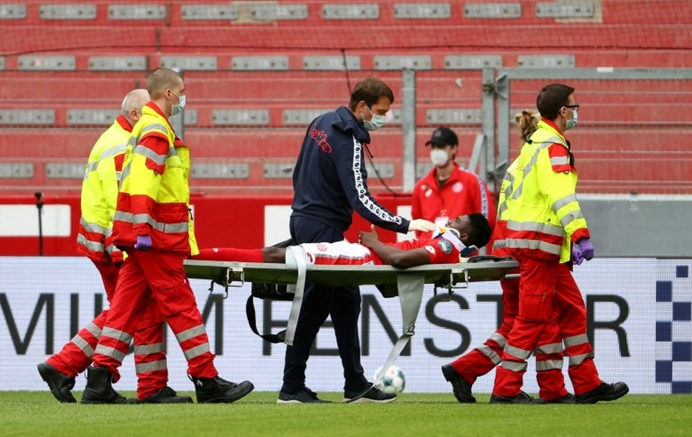 Awoniyi was knocked out cold during Mainz's clash against Augsburg. AFP