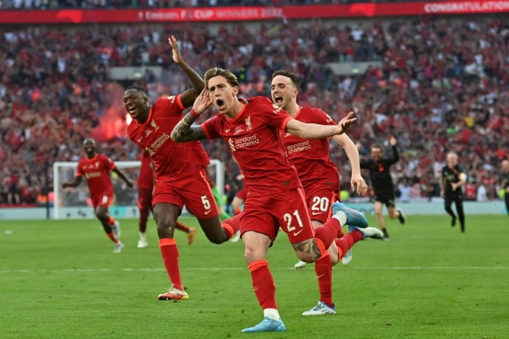 Kostas Tsimikas (C) scored the decisive penalty as Liverpool lifted the FA Cup. AFP