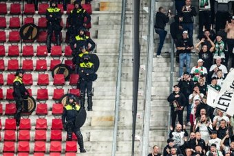 Poland and the Netherlands traded barbs and accusations Friday after Dutch police arrested two footballers from Polish club Legia Warsaw amid violent scenes during their Europa Conference League clash against AZ Alkmaar.