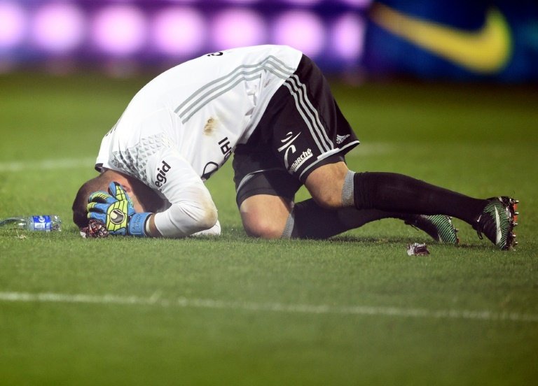 Lyons Portuguese goalkeeper Anthony Lopes reacts after a firecracker exploded beside him during their match against against Metz on December 3, 2016 at Saint Symphorien stadium in Longeville-Les-Metz, eastern France
