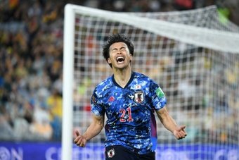 Kaoru Mitoma celebrates as Japan qualify. AFP