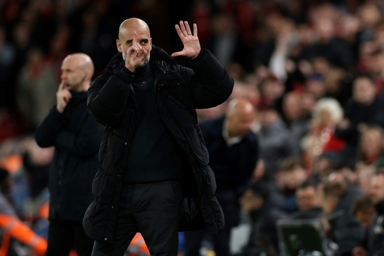 Guardiola responded to Liverpool fan taunts with six fingers, one for each of his PL title. AFP