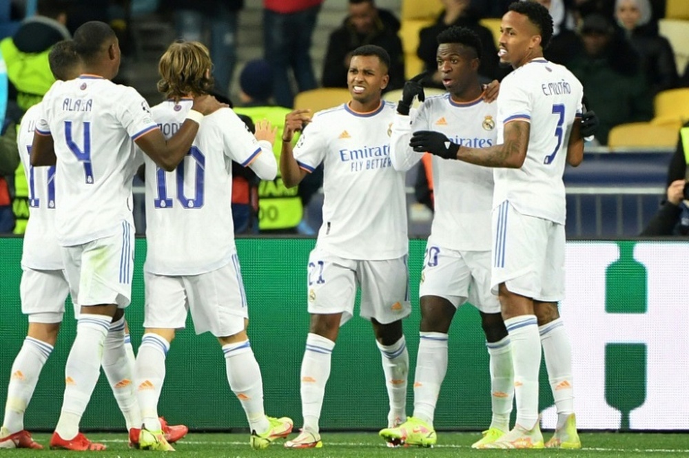 Vinicius was congratulated by his Real Madrid teammates after scoring twice. AFP