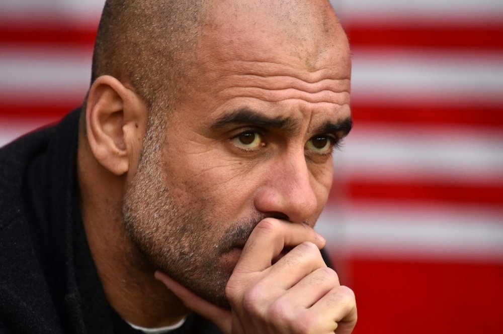 Guardiola says he is enjoying the challenge of battling for silverware. AFP
