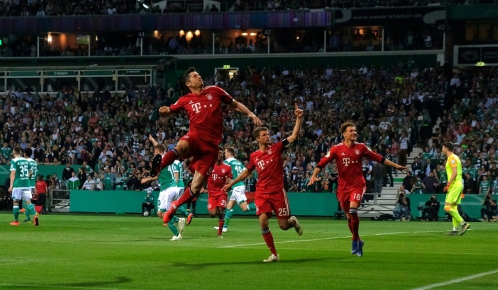 Robert Lewandowski fired them to a 3-2 win over a valiant Werder Bremen. AFP