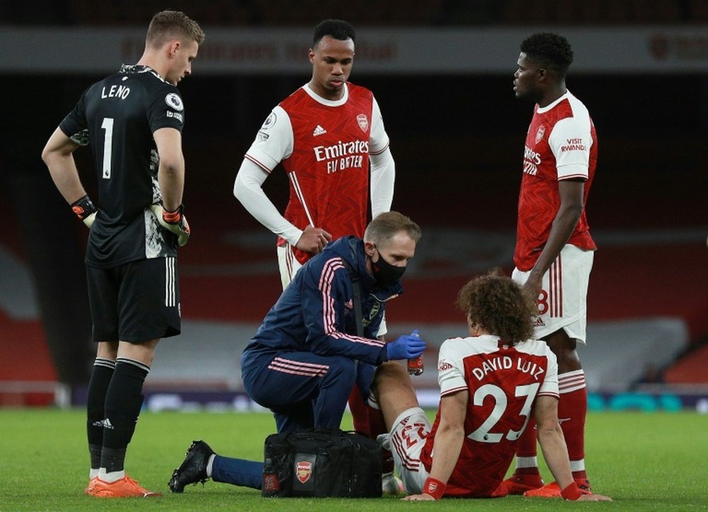 Arsenal defender David Luiz receives medical treatment at the Emirates Stadium. AFP