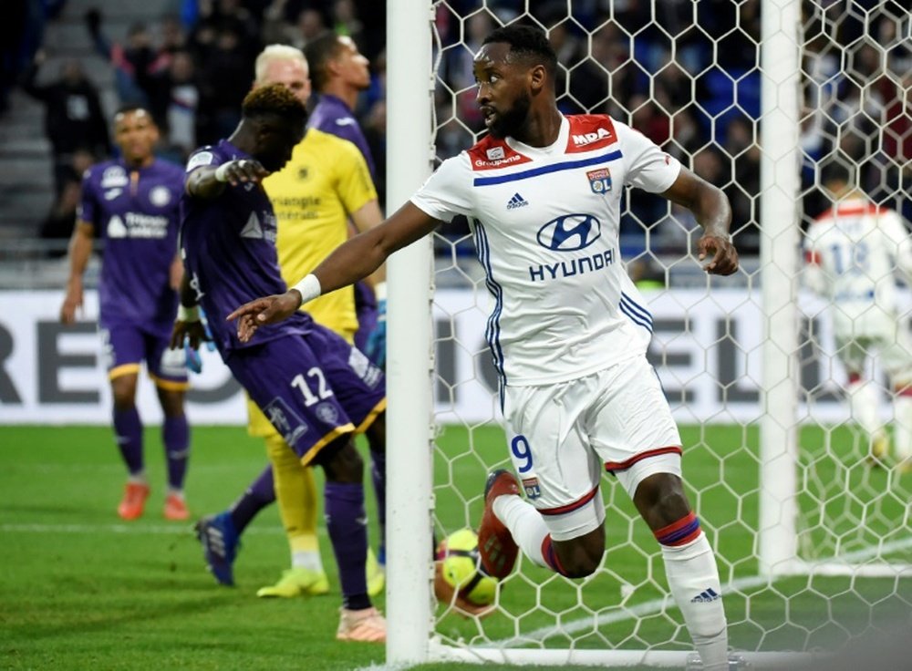 Former Celtic striker Dembele scored twice as Lyon thrashed Toulouse. AFP
