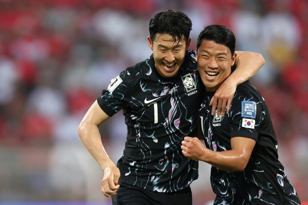 Hwang Hee-chan (R) scored against Oman on Tuesday. AFP