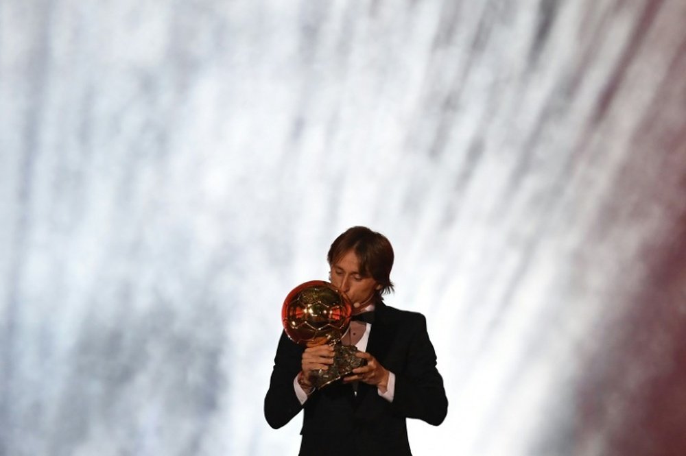 Real Madrid and Croatia midfielder Luka Modric kisses the trophy. AFP