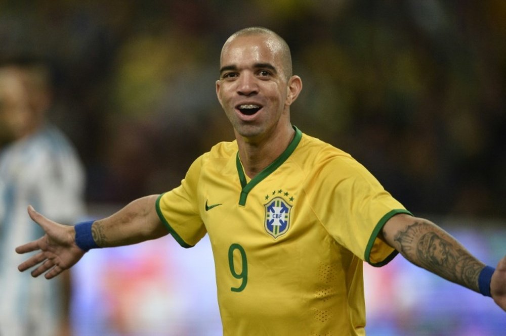 Tardelli has been banned for rubbing his face during the Chinese national anthem. AFP
