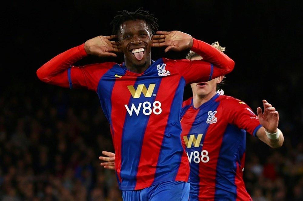 Wilfried Zaha celebrates scoring against Manchester City. AFP