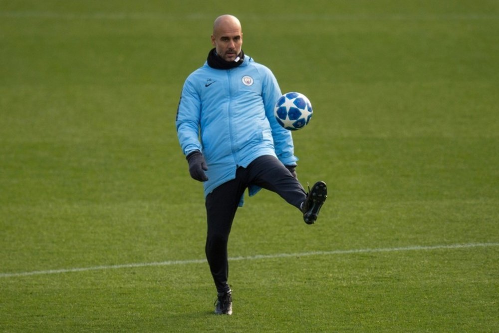 Guardiola has warned his City side against complacency. AFP