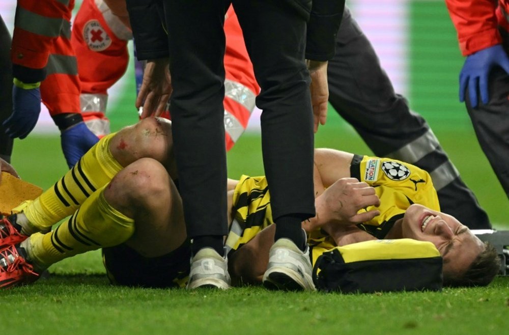 Nico Schlotterbeck was stretchered off the pitch with an apparent ankle injury on Wednesday. AFP