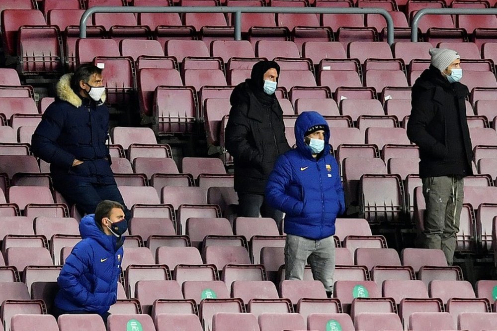 Lionel Messi, in the centre in the back row, watches Barcelona draw with Eibar. AFP