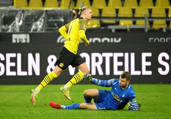 Haaland double sees Dortmund rout Freiburg to trim Bayern's lead. AFP