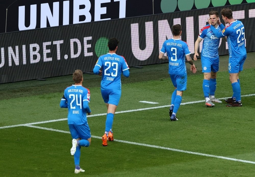 Simon Lorenz (2R) scored against Cologne. AFP