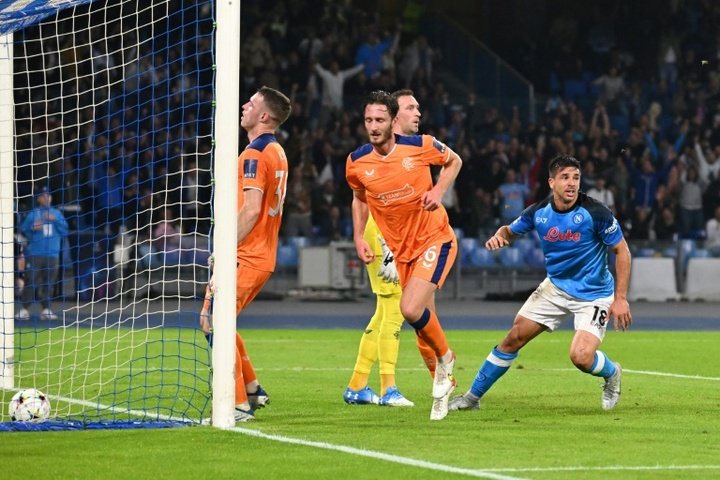 Giovanni Simeone (R) scored twice as Napoli easily beat Rangers. AFP