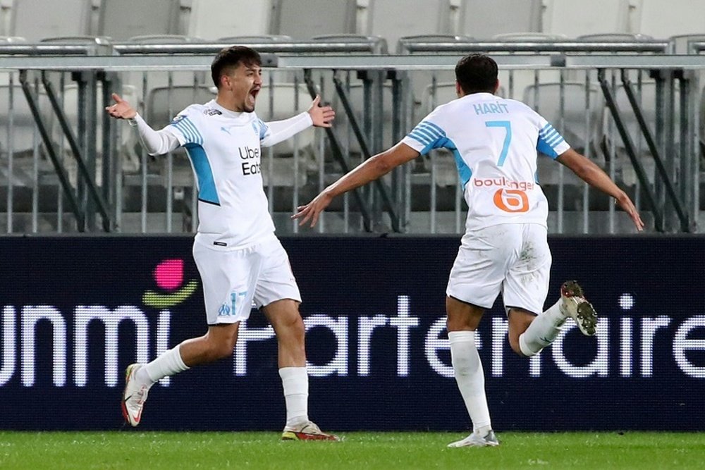 Under celebrates Amine Harit after scoring a goal during the match between Bordeaux and OL. AFP