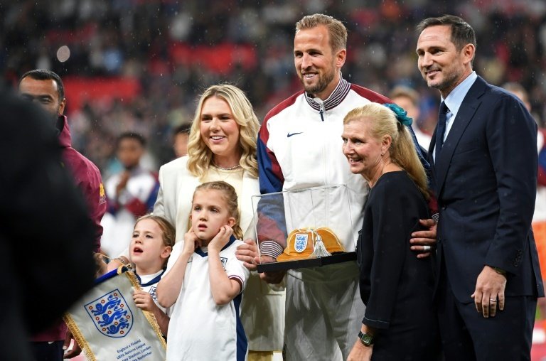 Kane was presented with a golden cap to mark his 100th England appearance. AFP