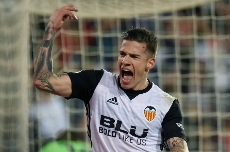 Santi Mina keeps Valencia on Champions League course. AFP