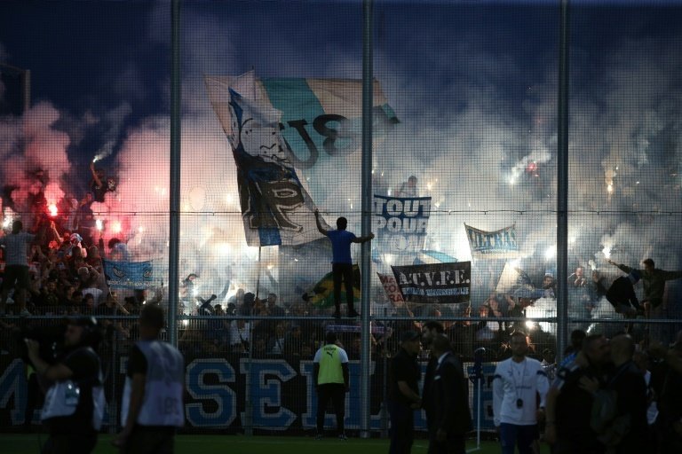 Prosecutors in southern France opened an investigation on Sunday after a journalist was attacked following a match between Ajaccio and Marseille, the second incident of violence at a French match in as many days.