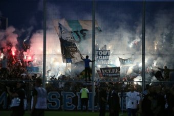 Prosecutors in southern France opened an investigation on Sunday after a journalist was attacked following a match between Ajaccio and Marseille, the second incident of violence at a French match in as many days.