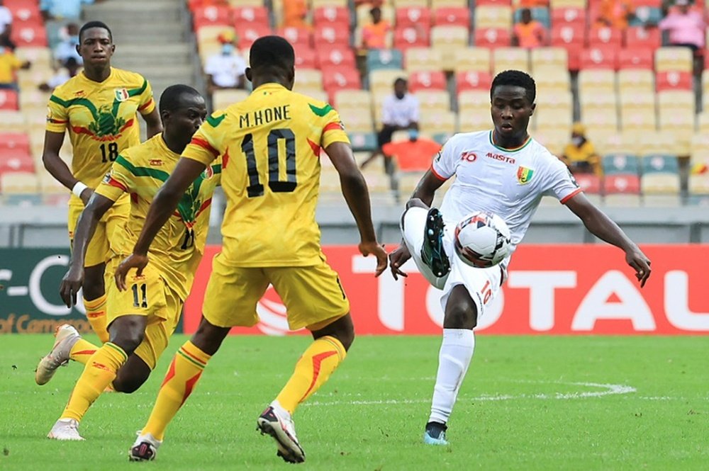Sylla (R) netted as Guinea beat Cameroon 2-0. AFP