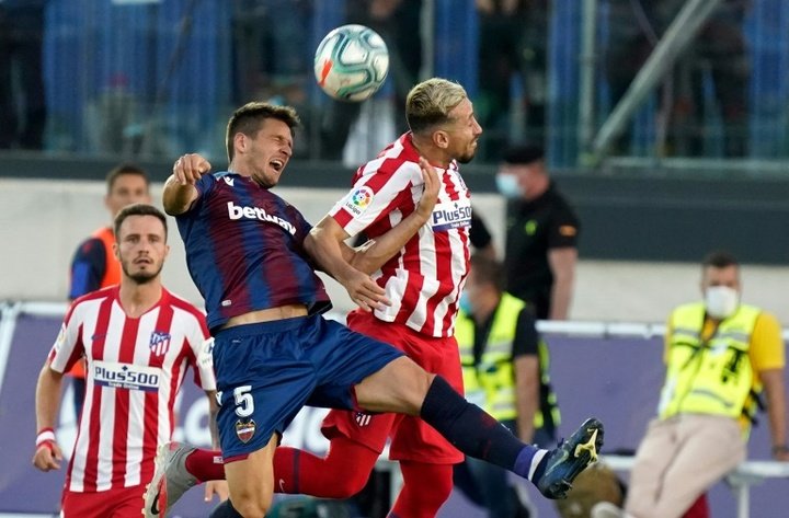 Atletico grind out Levante win to march into third