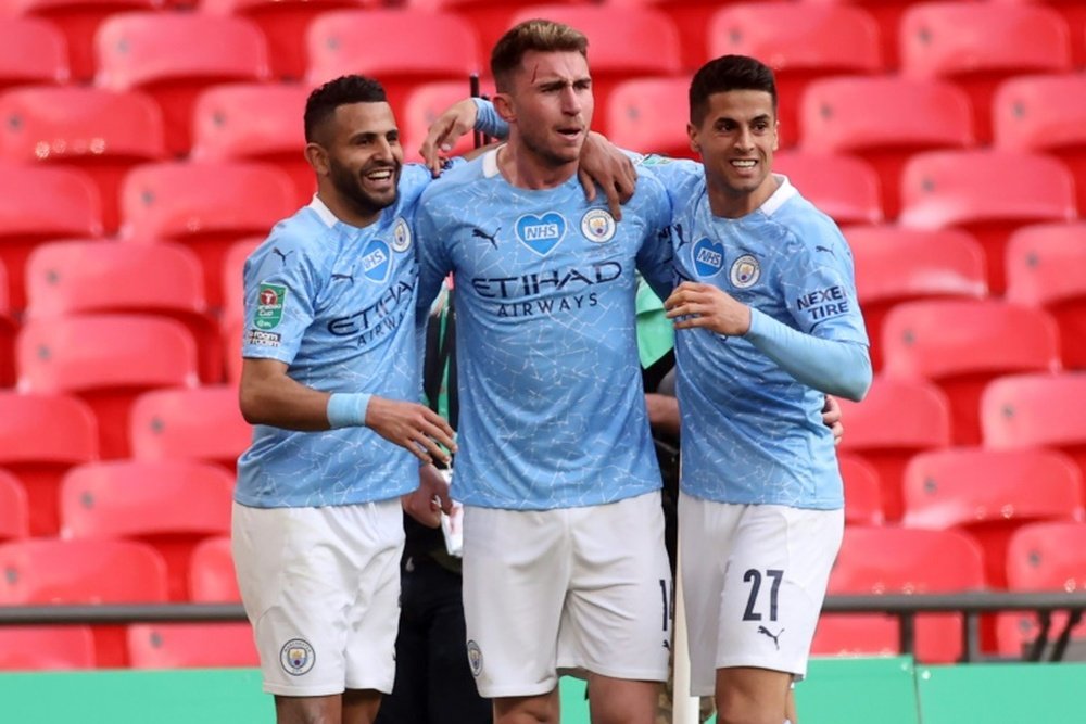 Aymeric Laporte (C) scored the only goal as Man City beat Spurs 1-0. AFP