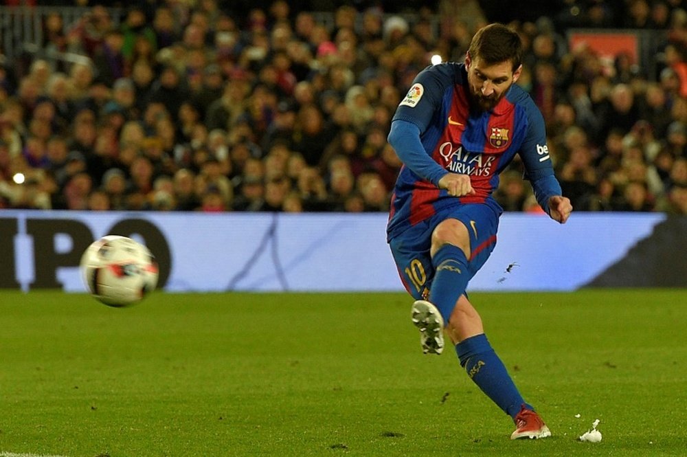 Barcelonas Argentinian forward Lionel Messi scores a goal during the Spanish Copa del Rey round of 16 second leg football match FC Barcelona vs Athletic Club de Bilbao at the Camp Nou stadium in Barcelona on January 11, 2017