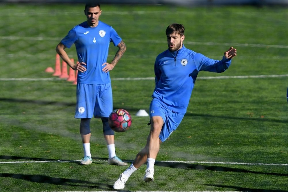 Luka Milunovic (R) is a Serbian footballer who plays in bitter enemy Albania. AFP