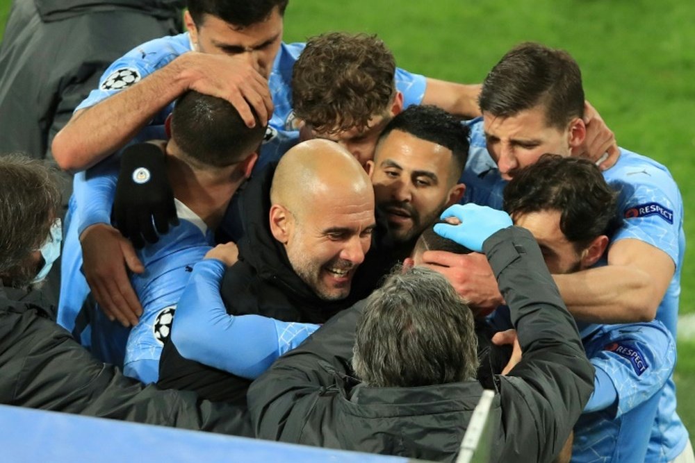 Pep Guardiola showered his team with praise after winning the Premier League. AFP