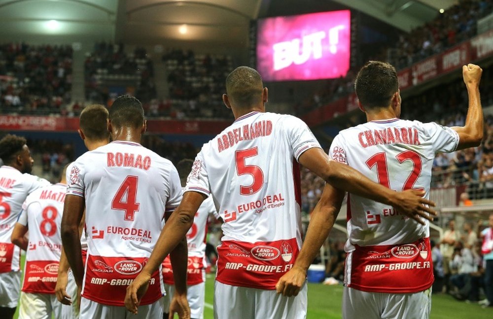 Reims celebrate after Chavarria scores the only goal of the game. AFP