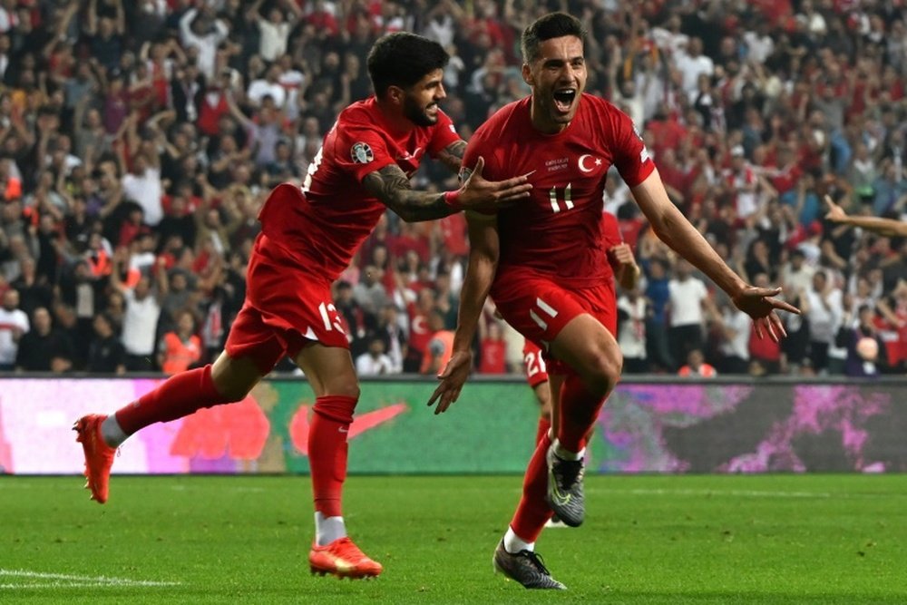 Turkey forward Umut Nayir (R) opened the scoring against Wales. AFP