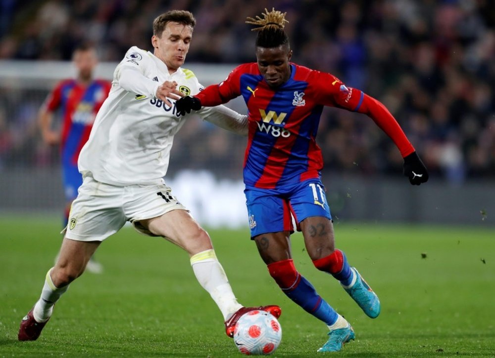 Leeds defender Diego Llorente vies with Crystal Palace forward Wilfried Zaha. AFP