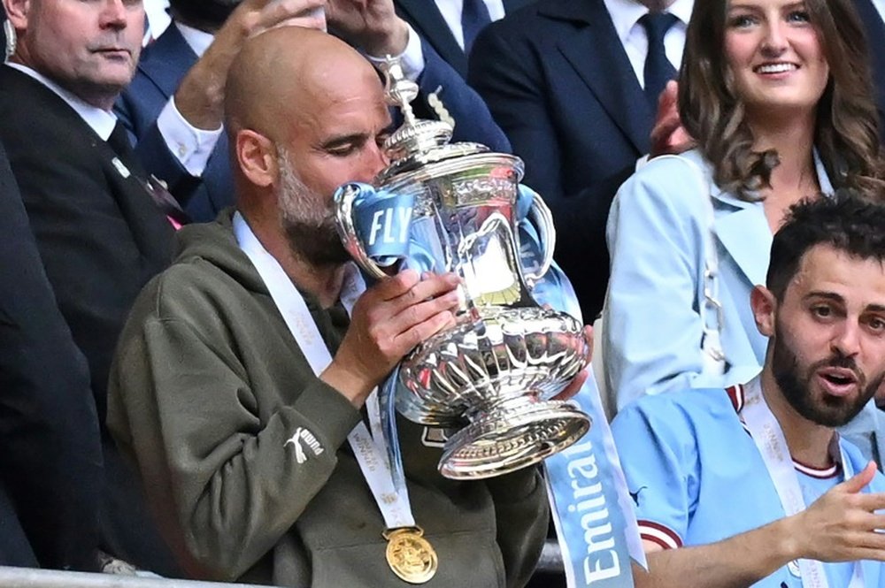 Guardiola is aiming to win a second successive FA Cup trophy. AFP