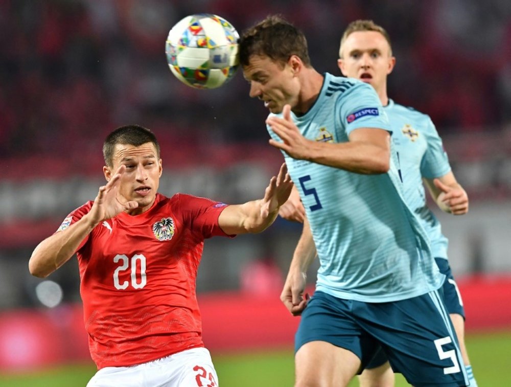 Jonny Evans has retired from international football. AFP