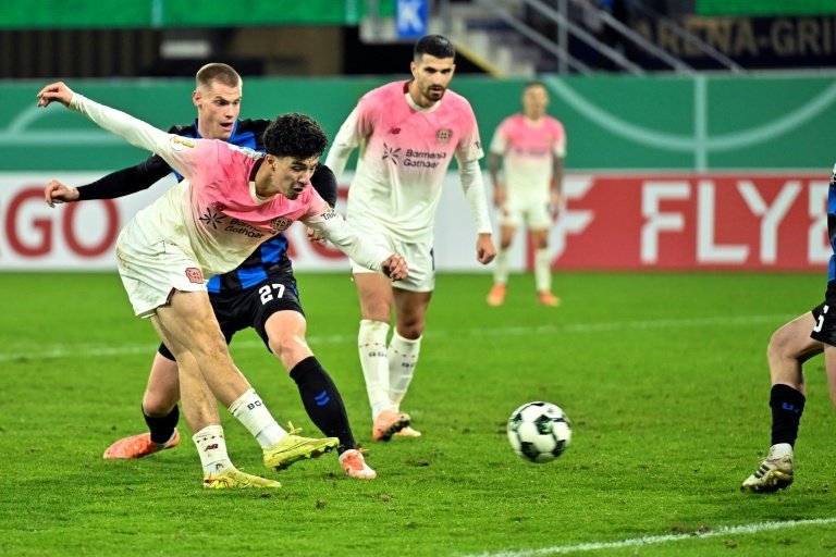 Bayer Leverkusen scored two goals after the 120-minute mark to win 4-2 at a 10-man Paderborn in the German Cup second round on Wednesday, as fellow Bundesliga side and reigning champions Stuttgart eased through.